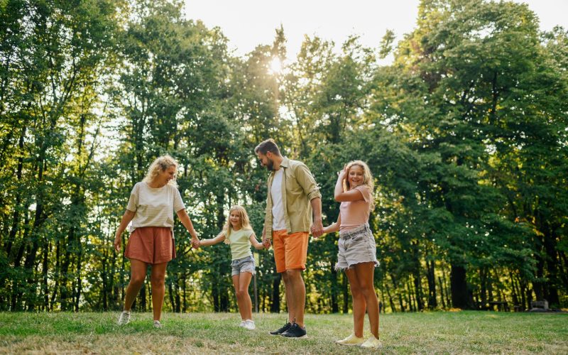 a-cheerful-family-holding-hands-and-spending-free-2026-03-25-01-24-57-utc 2